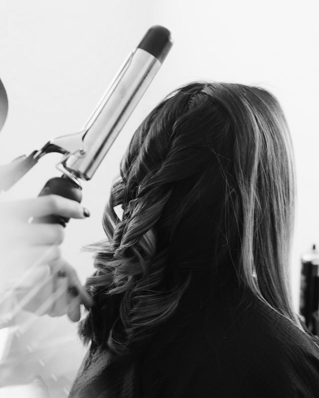 Woman receiving hair service